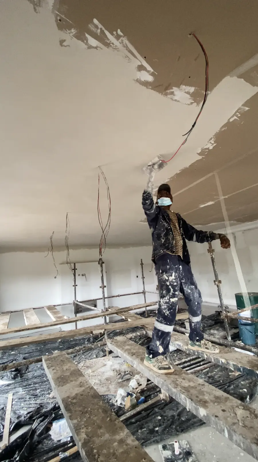Ceiling installation Harare — Tawaka Contracting tradesman finishing a new ceiling with services roughed in above, Glen Lorne Zimbabwe