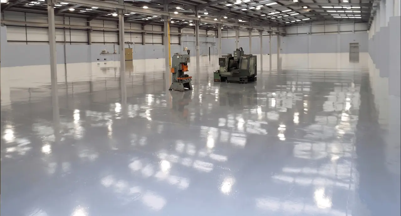 Industrial epoxy flooring Harare — seamless resin floor installed in a Pomona warehouse by Tawaka Contracting