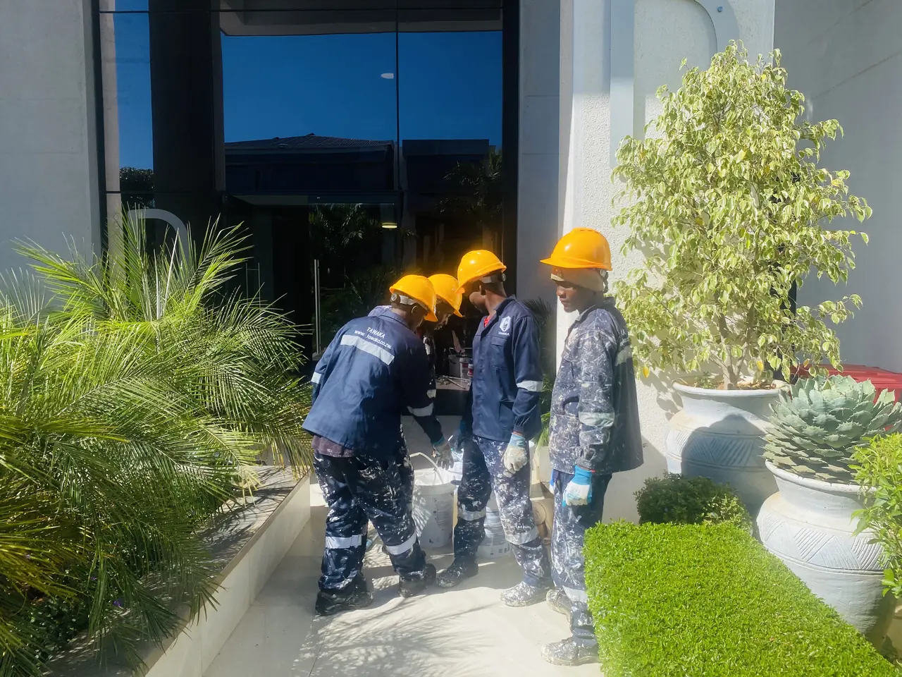 Commercial construction Harare — Tawaka Contracting crew working at a corporate office entrance renovation in Zimbabwe