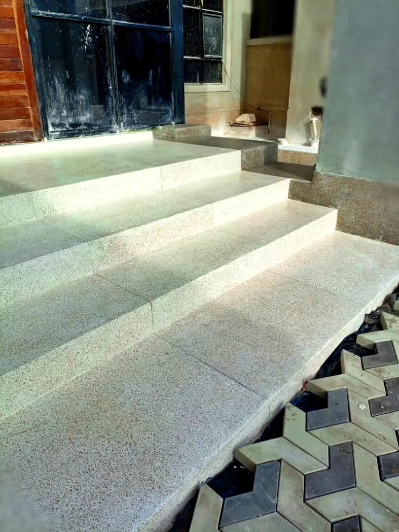 Terrazzo steps Harare — polished terrazzo treads and risers finished against interlocking paving in Greendale, Zimbabwe